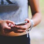 Can I text my spouse during divorce? Woman texting on smartphone